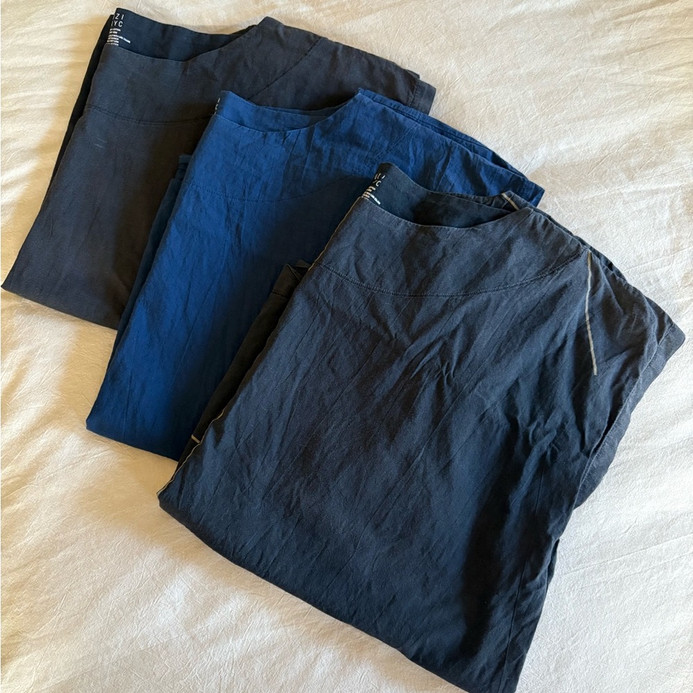 AZI NYC box tops set of (2) shirts.

The black with LINES IS SOLD.